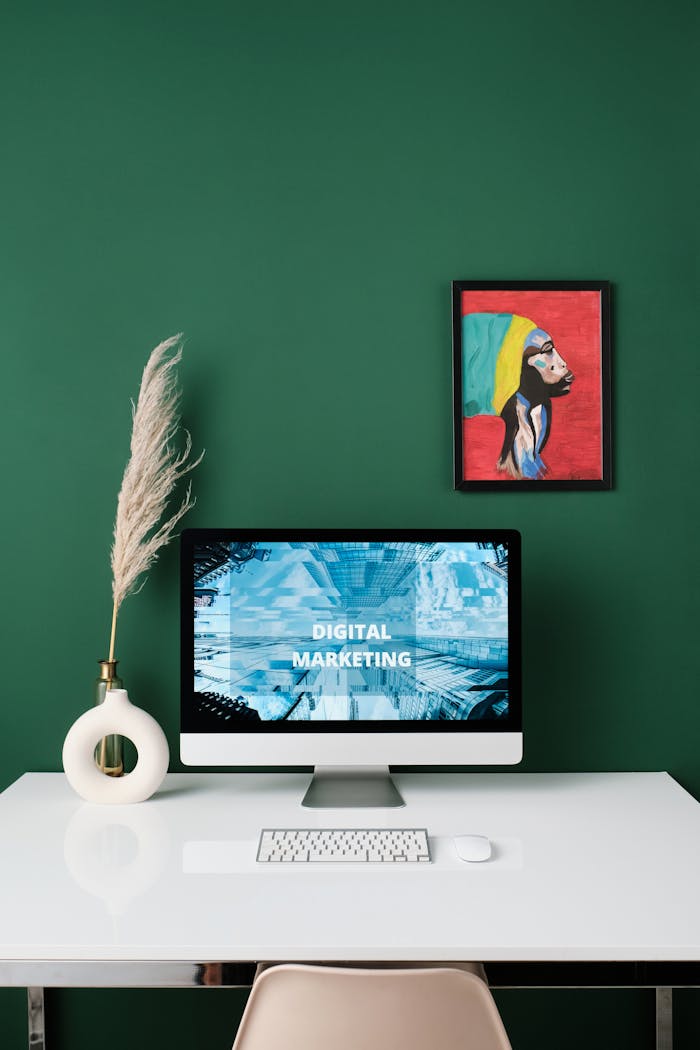 services-03 A sleek modern workspace featuring digital marketing concepts on a computer screen and artistic decorations.